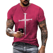 Men's Christian Cross T-shirt in red with white cross nail design worn by tattooed man holding a smartphone