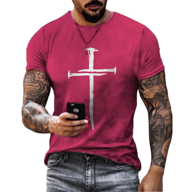 Men's Christian Cross T-shirt in red with white cross nail design worn by tattooed man holding a smartphone