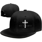 Black religious caps for men with a white cross and 'Not Ashamed Romans 1:16' design by Fresh Faith Designs