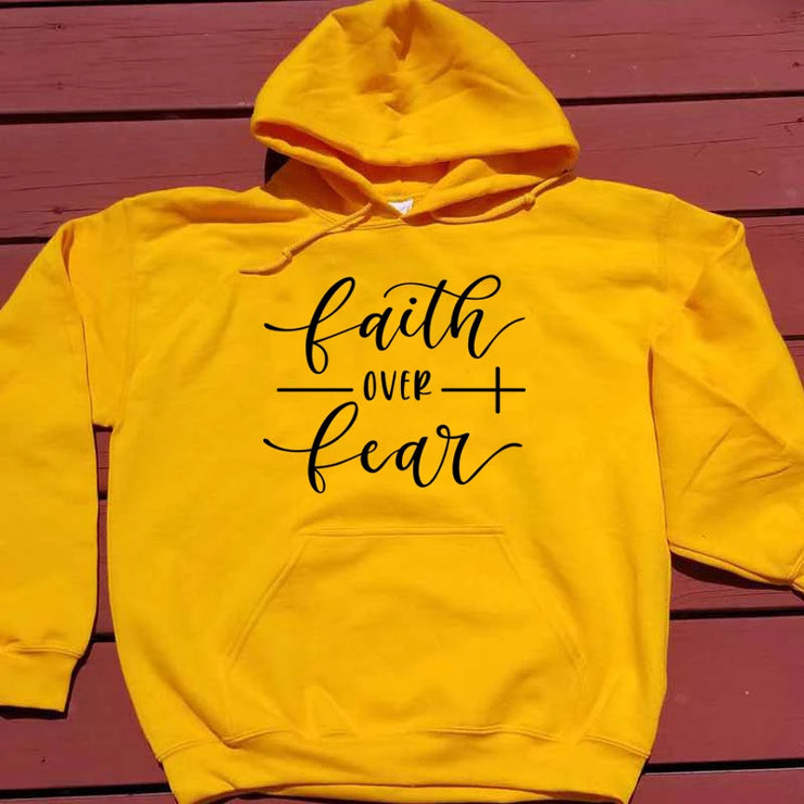 Yellow hoodie with faith over fear design, religious casual apparel for everyday wear