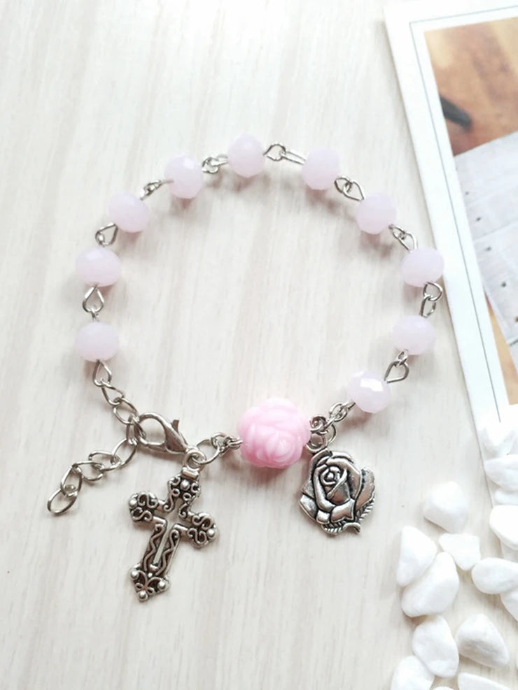 Pink bead bracelet with cross and rose charms from Fresh Faith Designs religious jewelry for women