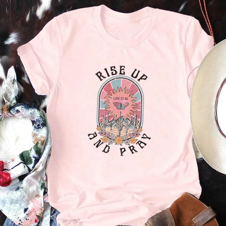 Fresh Faith Designs Bible verse graphic tee short sleeve pink shirt with Rise Up and Pray design