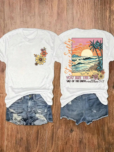 Fresh Faith Designs Bible verse beach shirt with sunset ocean waves palm trees and floral design