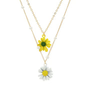 Fresh Faith Designs layered necklace with yellow and white daisy charms and delicate gold chains
