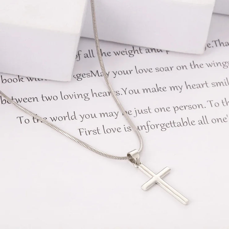 Fashion crystal cross necklace by Fresh Faith Designs with a sleek silver chain on white background