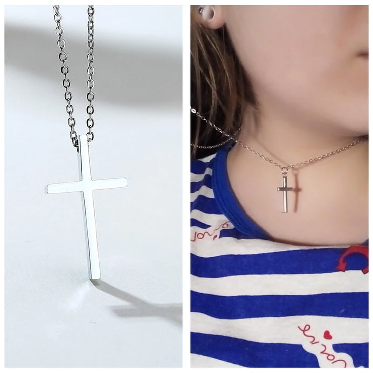 Silver cross necklace from Fresh Faith Designs worn by woman featuring women's faith jewelry