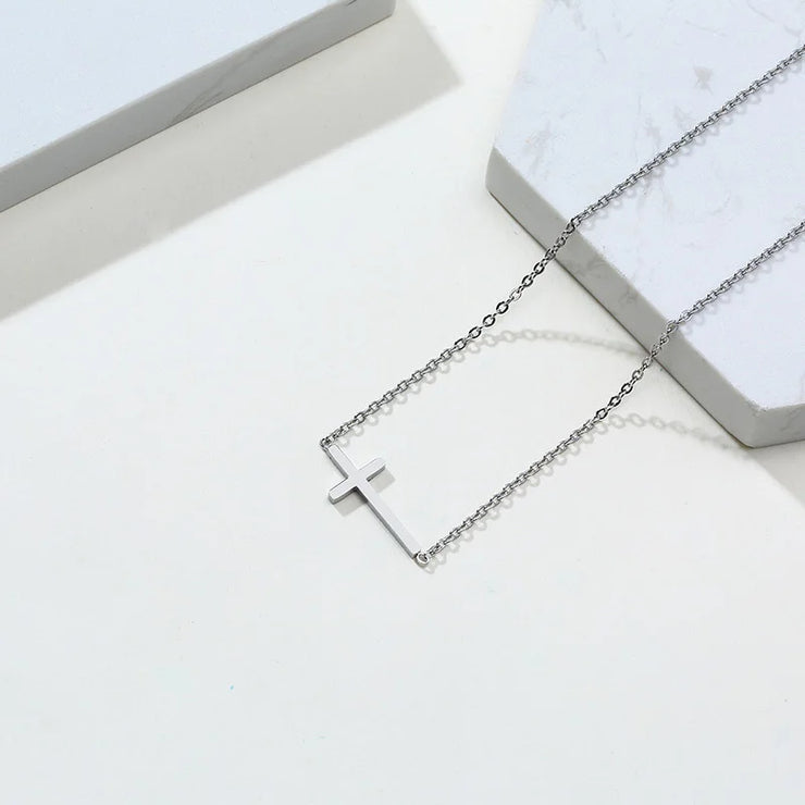 Silver cross necklace on a chain from Fresh Faith Designs women's faith jewelry collection