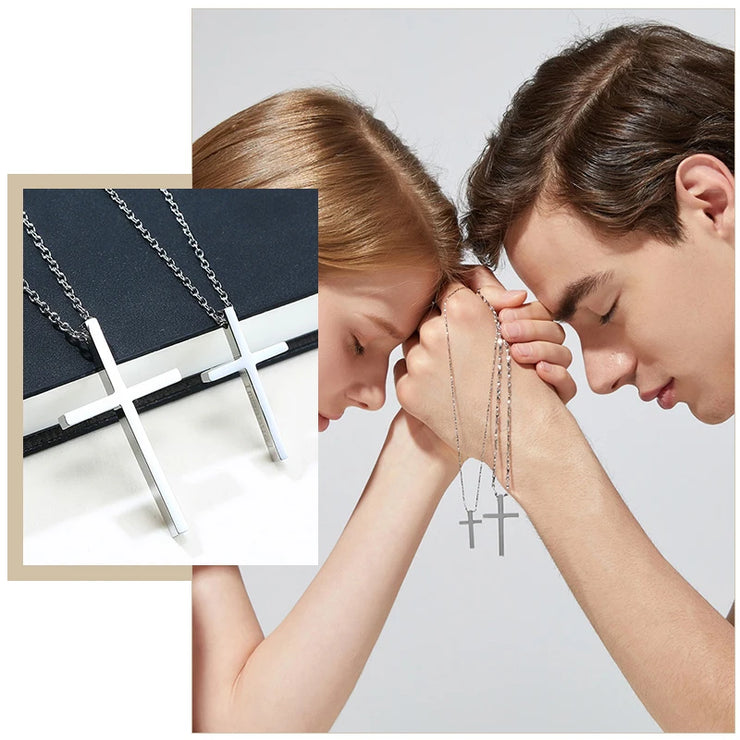Women's faith jewelry featuring silver cross necklaces worn by man and woman praying together