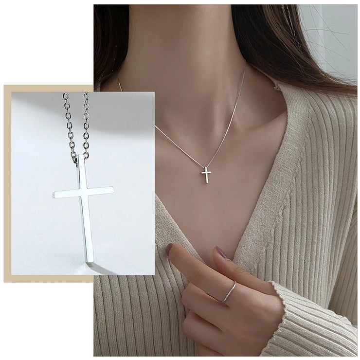 Delicate silver cross necklace from Fresh Faith Designs women's faith jewelry worn with beige sweater