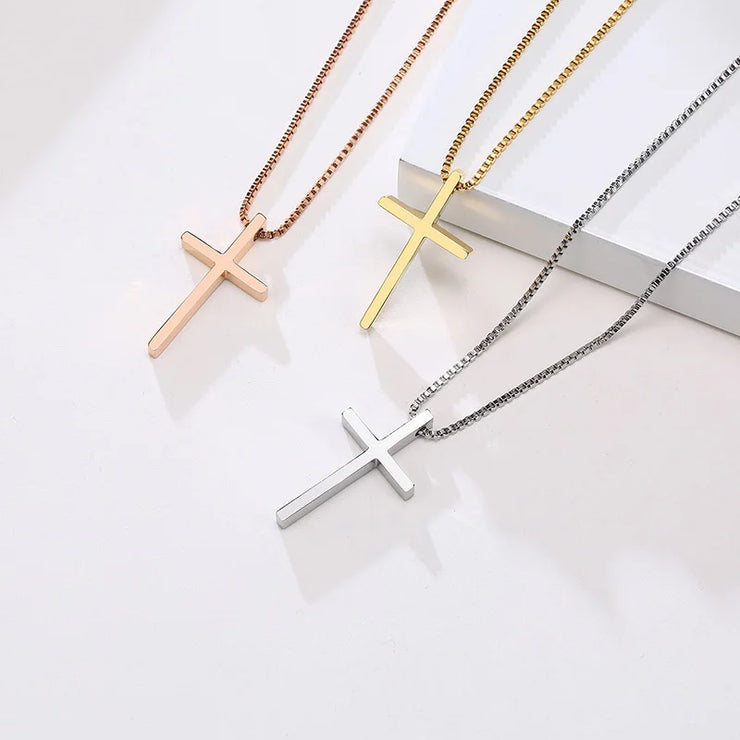 Women's faith jewelry featuring three cross necklaces in rose gold, gold, and silver finishes