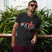 Man wearing a black vintage faith cross tee with a distressed red cross design on the front