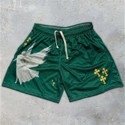 Fresh Faith Designs Y2K Christian gym shorts in green with white dove and yellow cross accents
