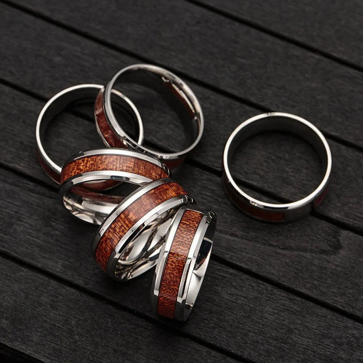 Men's Christian jewelry wooden inlay silver rings by Fresh Faith Designs on dark wood surface